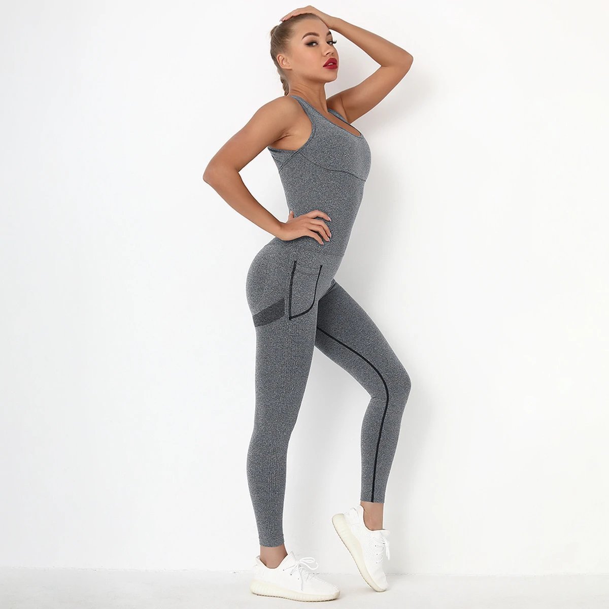 A jumpsuit is a one – piece outfit combining a top and trousers — O-11821