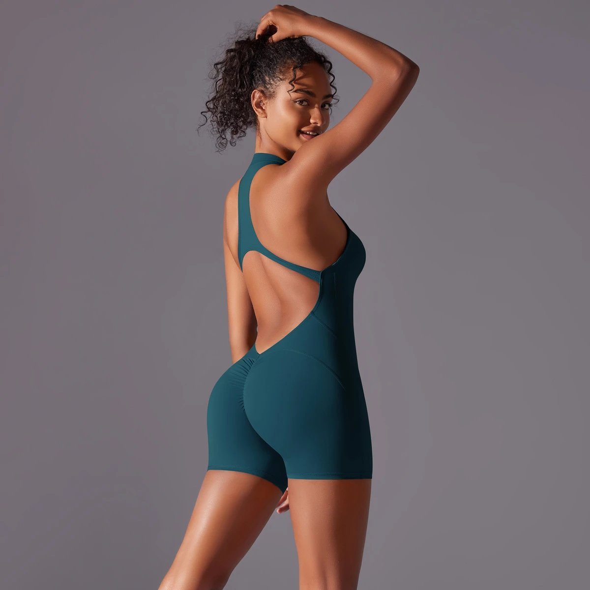 A jumpsuit is a one – piece outfit combining a top and trousers . — O-12017