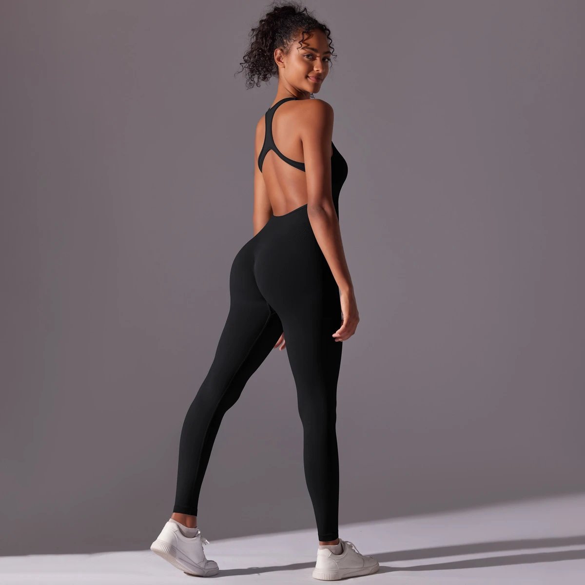 A jumpsuit is a one – piece outfit combining a top and trousers. — O-12019