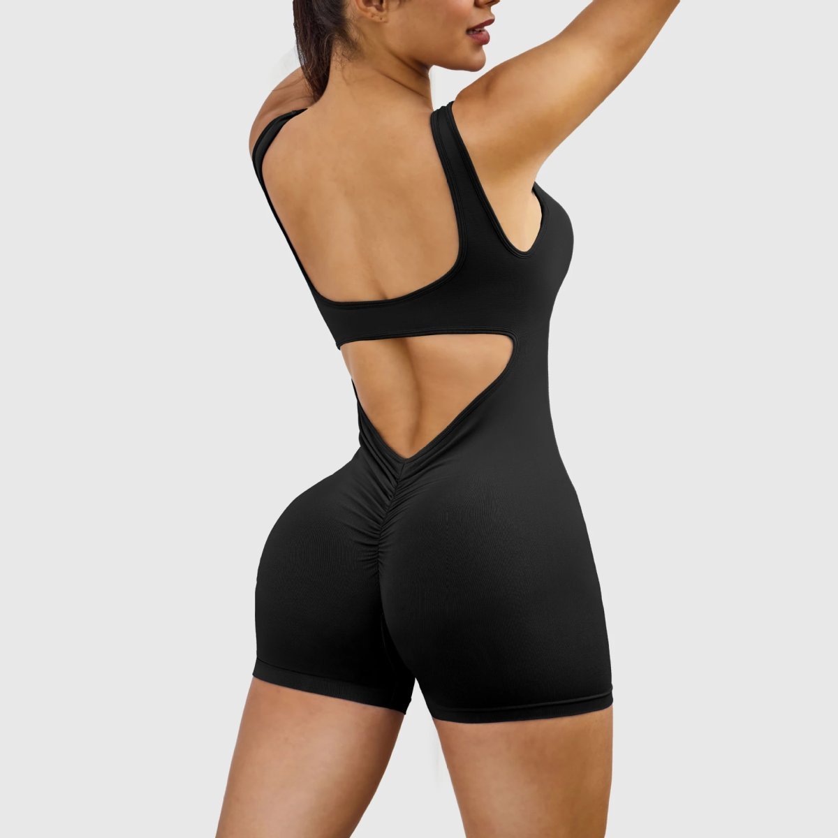 A jumpsuit is a one – piece outfit combining a top and trousers — O-12035